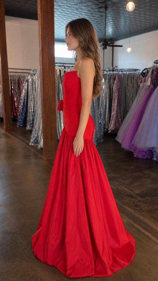 Side profile view of red mermaid evening gown