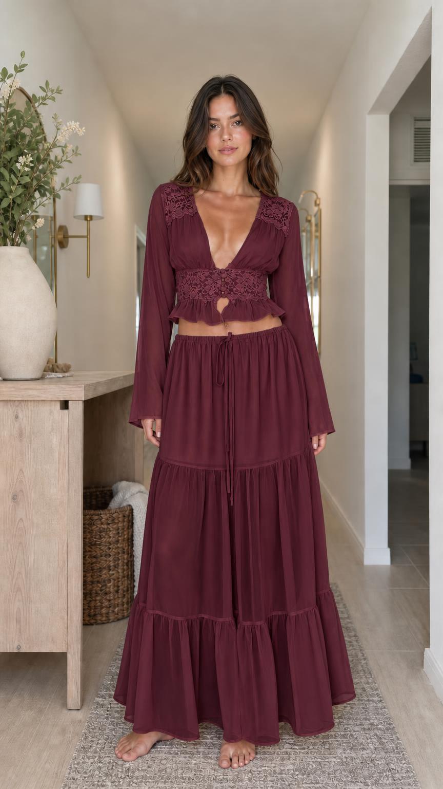 Model wearing burgundy two-piece set