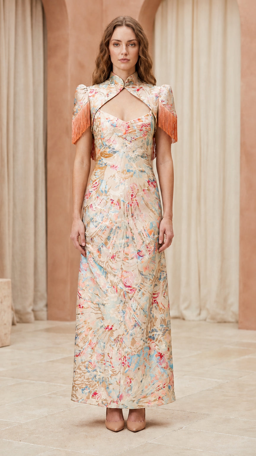 Front view of model wearing champagne floral brocade maxi dress