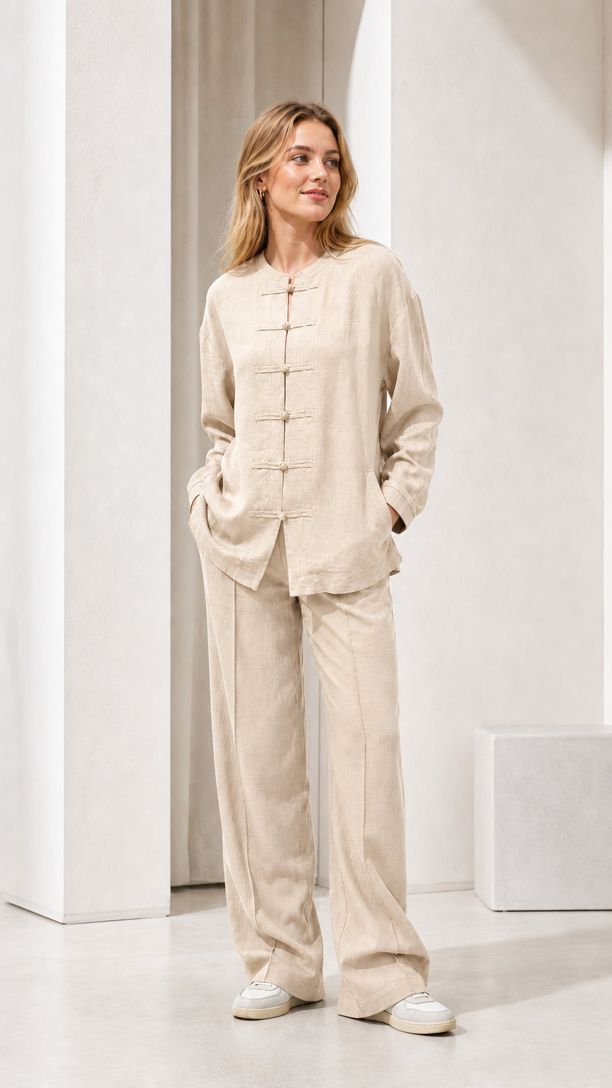 Model wearing beige linen-blend long sleeve top and wide leg pants set