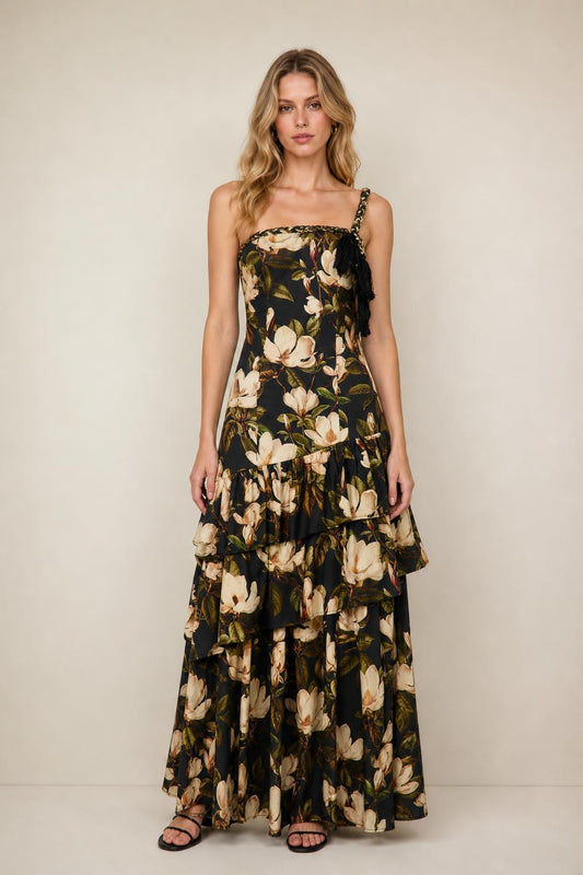 Front view of floral print tiered maxi dress in black on a model