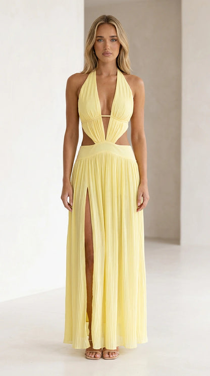 Front view of yellow halter neck cutout pleated maxi dress