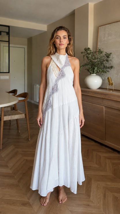 Front view of woman wearing white halter maxi dress