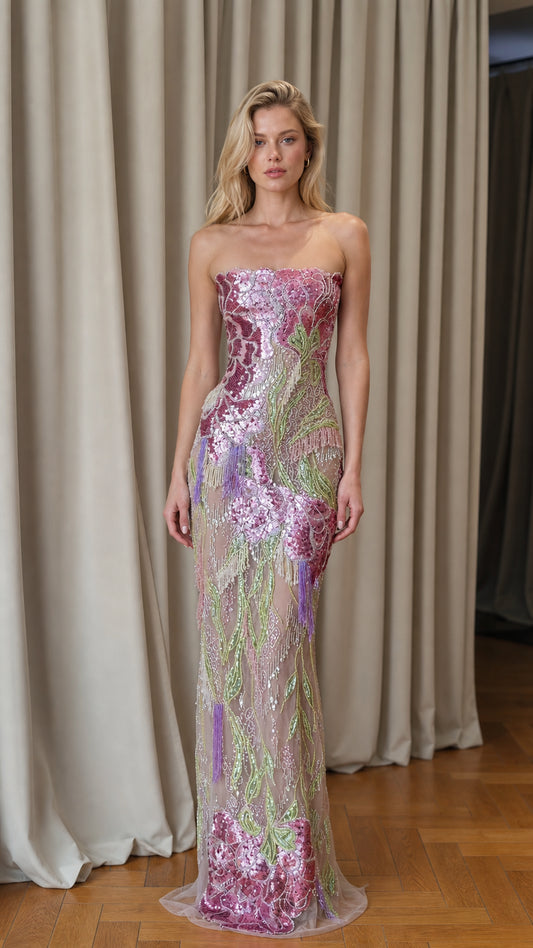 Front view of model wearing pink floral sequin strapless evening gown