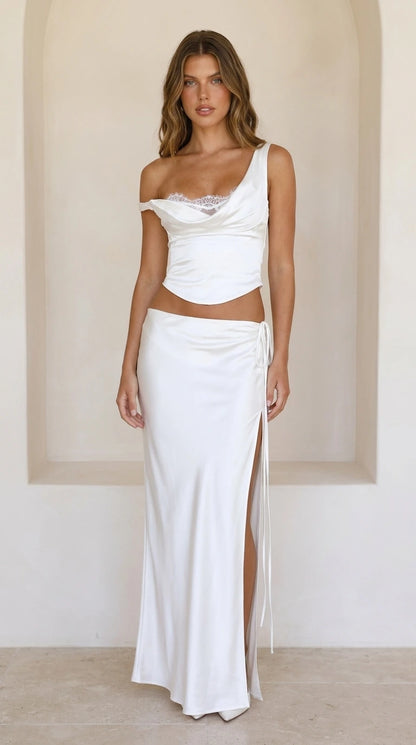 Front view of white satin lace-trim crop top and high-slit maxi skirt set