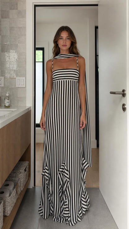 Front view of model wearing black and white striped maxi dress with scarf