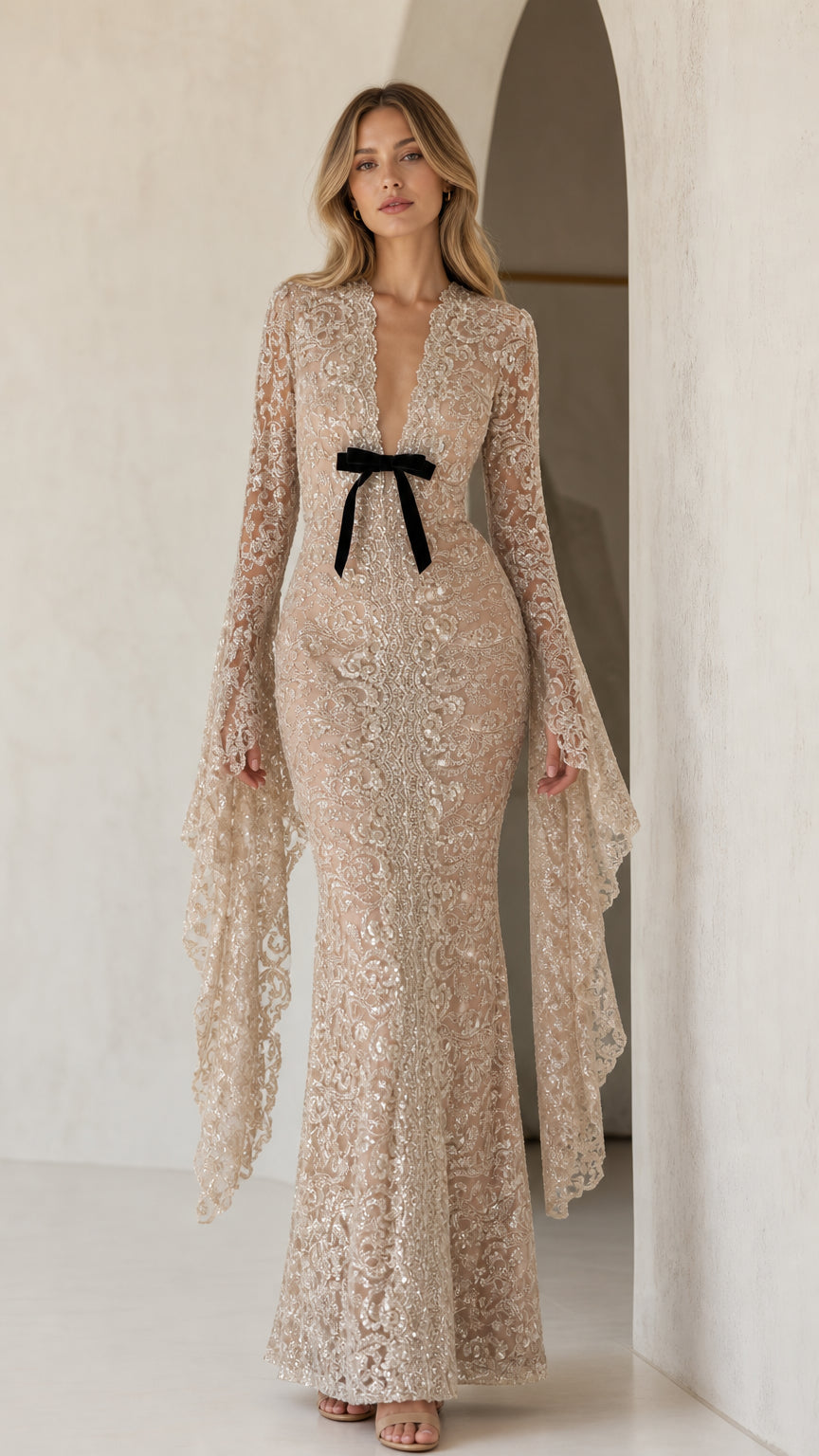 Front view of model wearing champagne sequin lace maxi dress