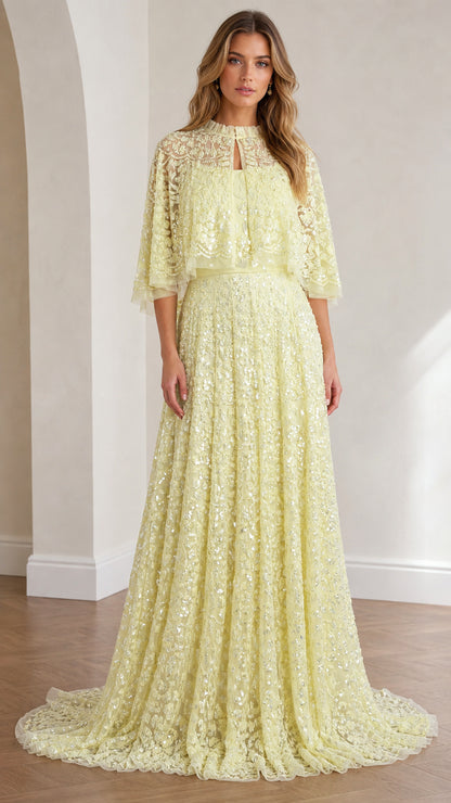 Front view of yellow sequin lace capelet evening gown