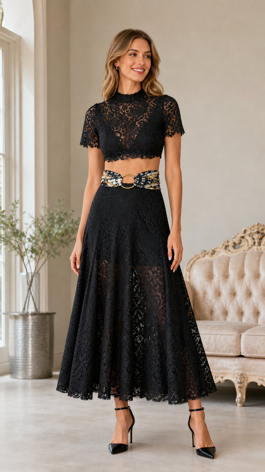 Front view of woman wearing black lace crop top and midi skirt set