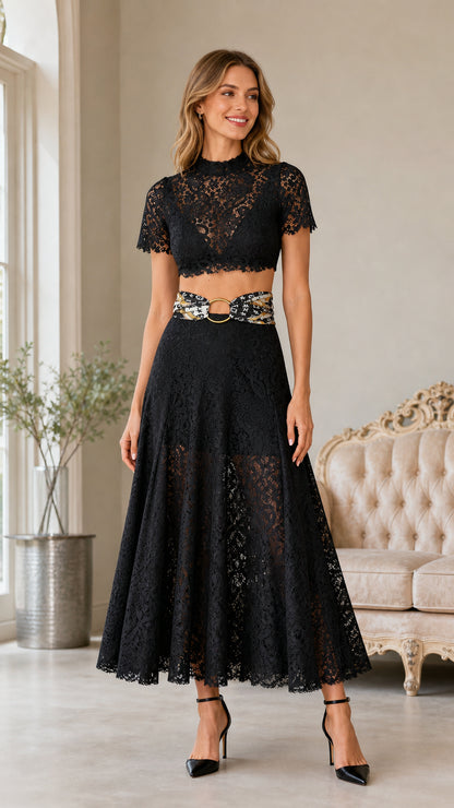 Front view of woman wearing black lace crop top and midi skirt set