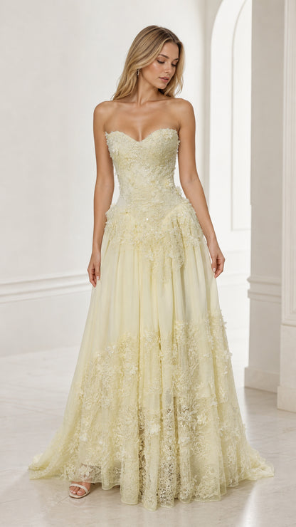 Front view of yellow strapless floral applique ball gown