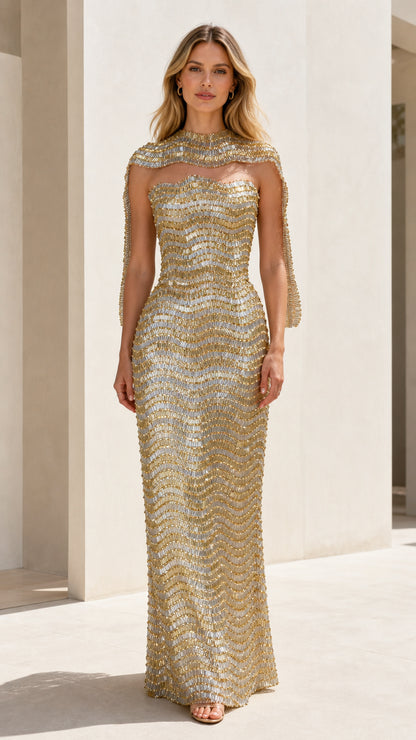 Front view of model wearing gold sequin strapless gown with matching shrug