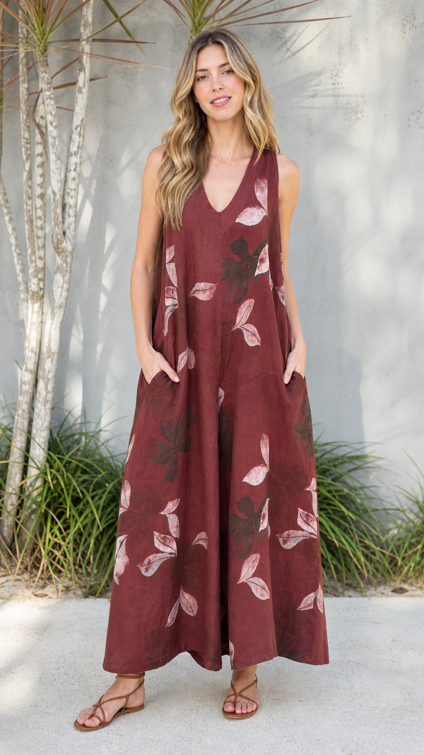 Front view of burgundy leaf print wide leg jumpsuit