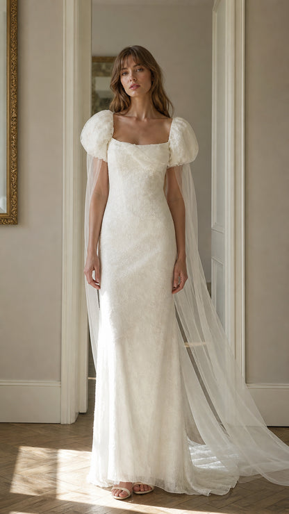 Front view of white lace maxi dress with cape