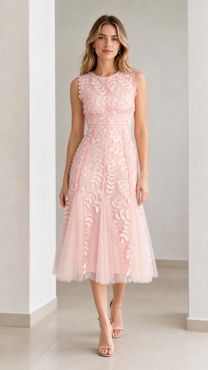 Front view of model wearing pink embroidered leaf applique midi dress