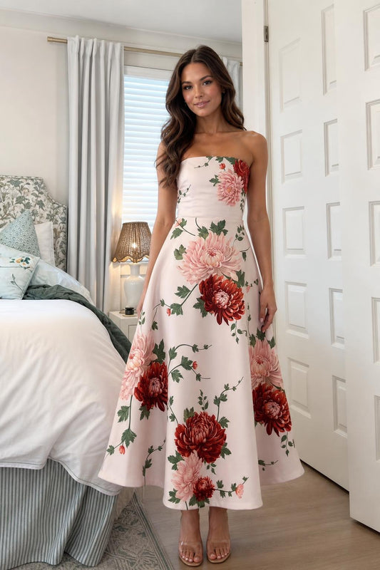 Front view of woman wearing pink floral strapless midi dress