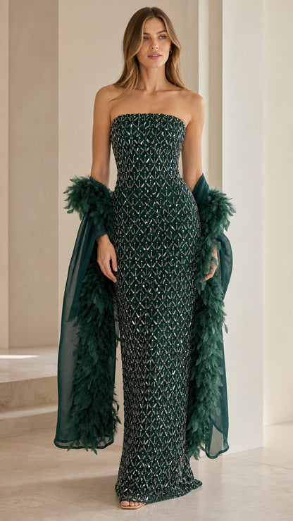 Front view of emerald green sequin strapless gown with feather wrap
