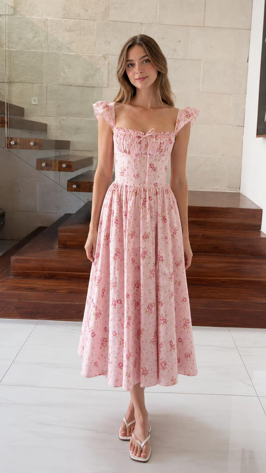 Front view of model wearing pink floral midi dress
