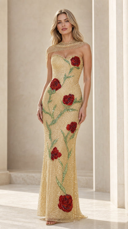 Front view of model wearing gold glitter evening gown with red roses