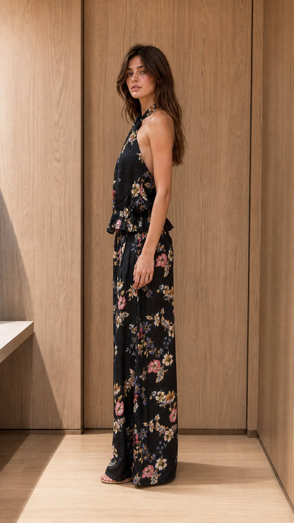Side profile view of black floral two-piece set on model