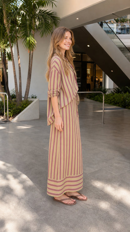 Model wearing khaki striped two-piece set, side view