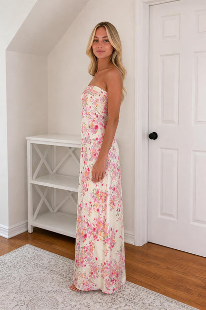 Side view of model in ivory floral strapless maxi dress