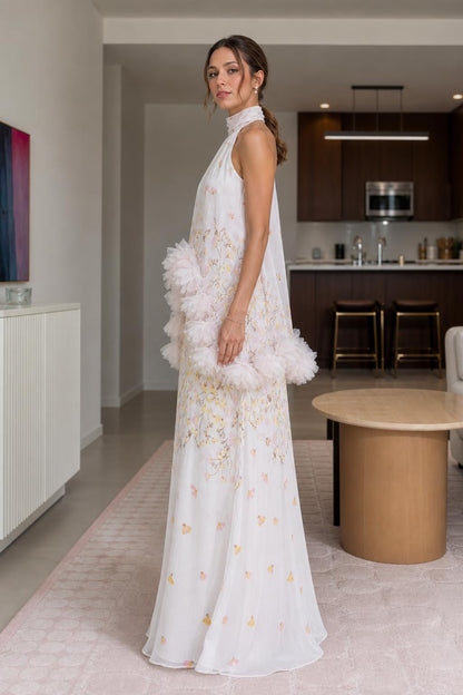 Side view of white floral halter maxi dress