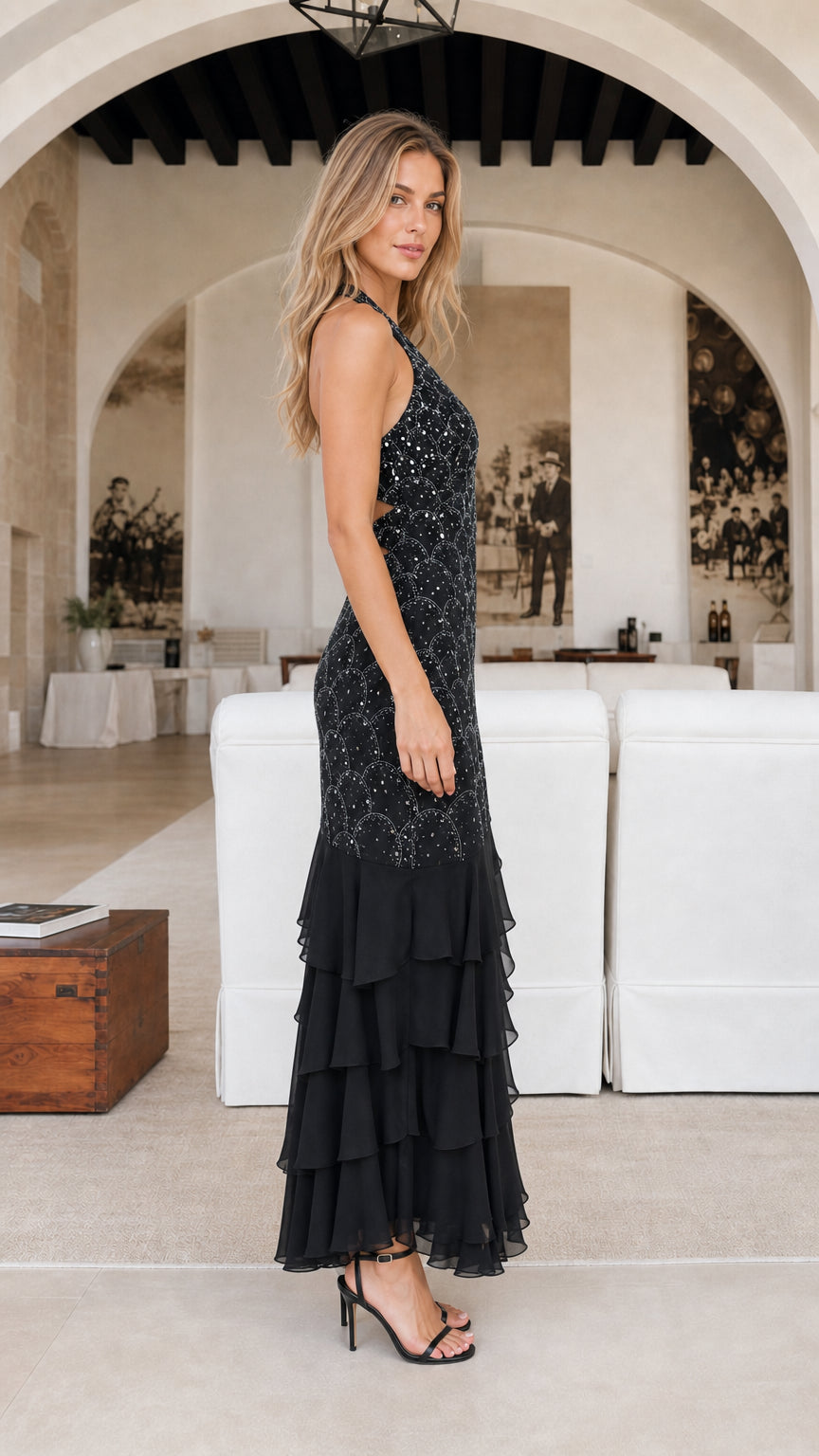 Side profile of black evening gown with ruffles