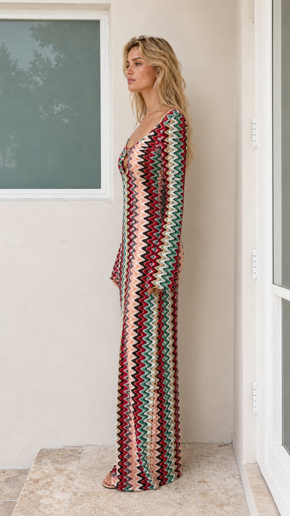 Side profile of model in Multicolor chevron knit maxi dress