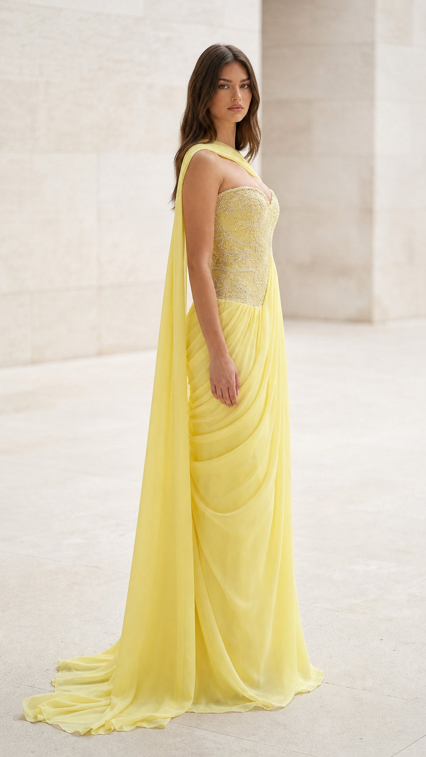 Side profile view of yellow evening gown