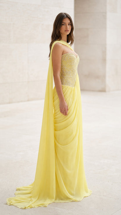 Side profile view of yellow evening gown