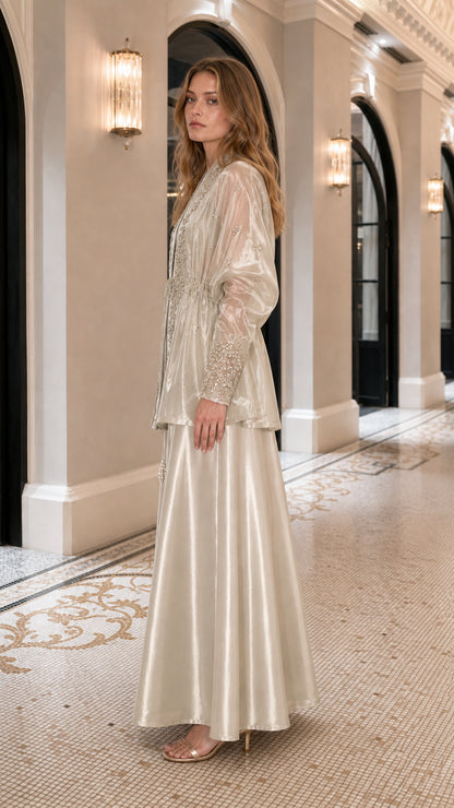 Side profile view of champagne two-piece set in a hallway