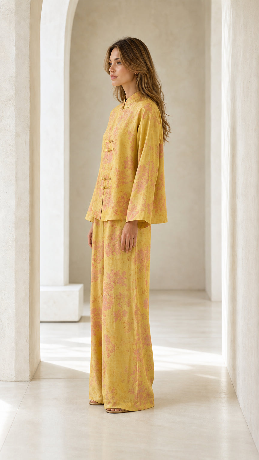 Side profile view of woman in yellow floral two-piece set