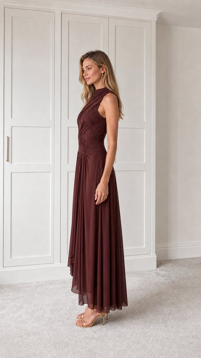 Side profile of burgundy pleated maxi dress