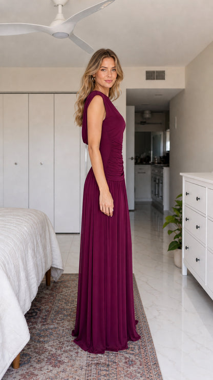 Side profile view of burgundy evening dress