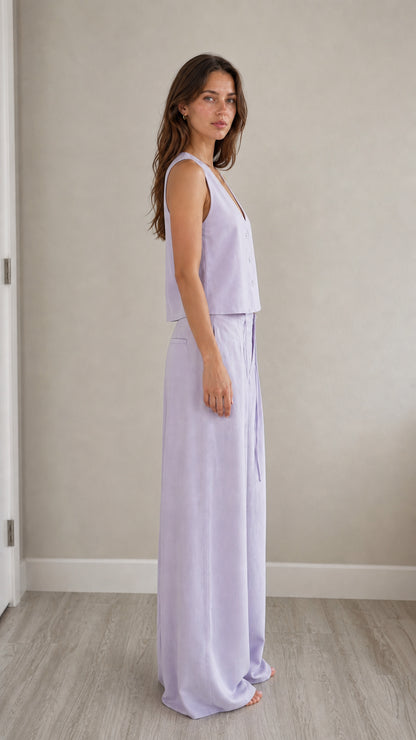 Side profile view of model in lavender two-piece set