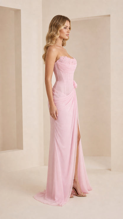 Side profile view of the pink evening gown with high slit