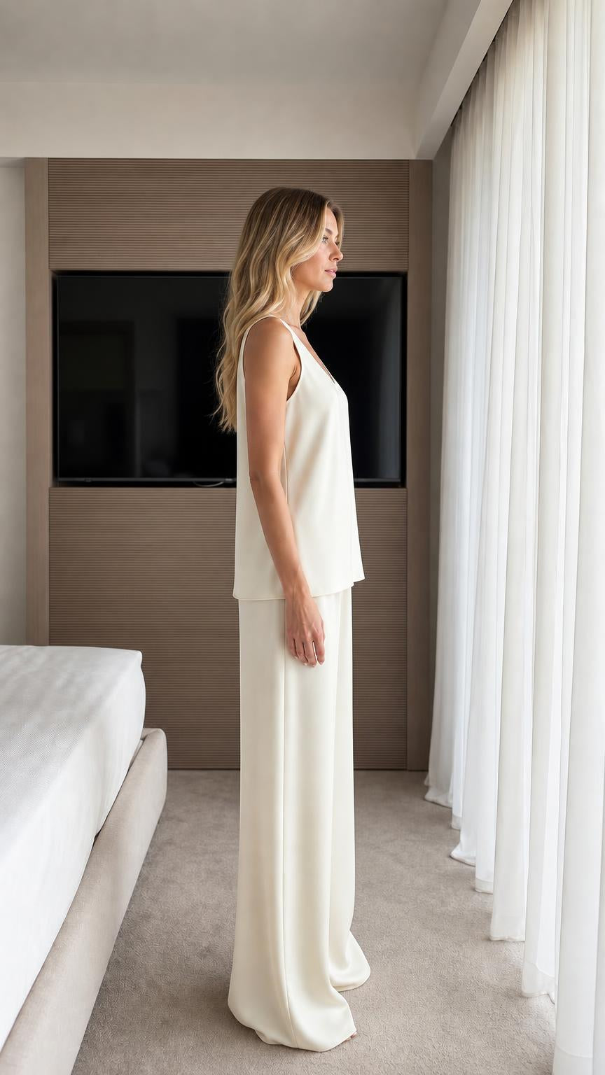 Side view of model wearing ivory lounge set