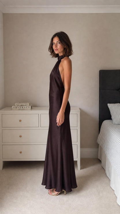 Model wearing dark brown satin maxi dress side profile