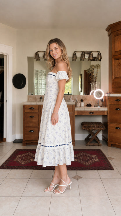 Side profile view of white floral midi dress