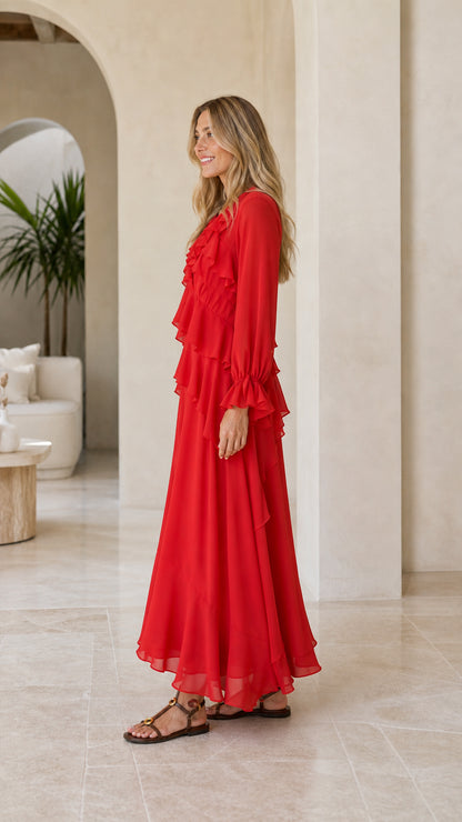 Model wearing red tiered ruffle long sleeve maxi dress side view