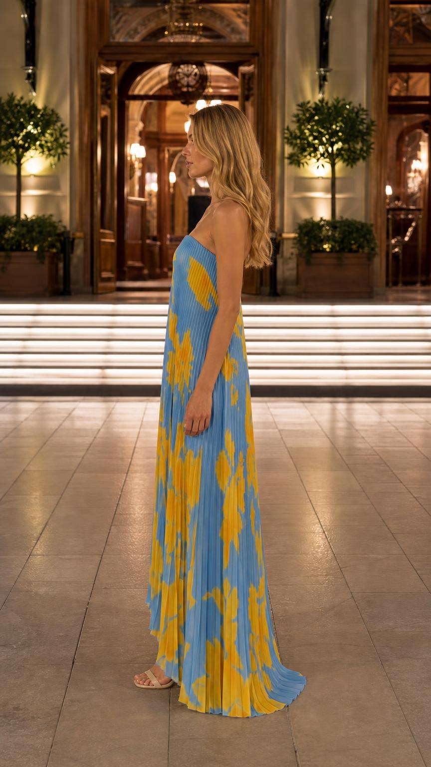 Side view of blue floral pleated maxi dress