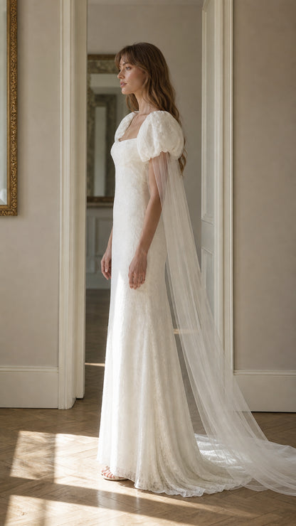 Side profile view of white lace maxi dress