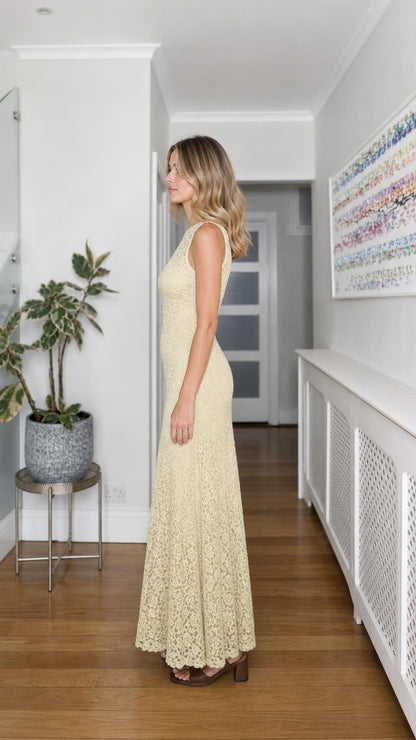 Side profile of yellow lace maxi dress
