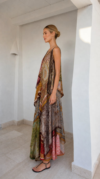 Side profile of model in flowing patchwork maxi dress