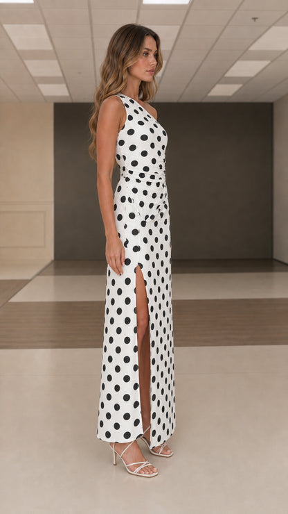 Side profile view of white polka dot one shoulder maxi dress