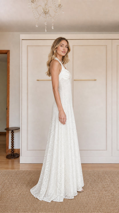 Side profile of model in White lace evening gown