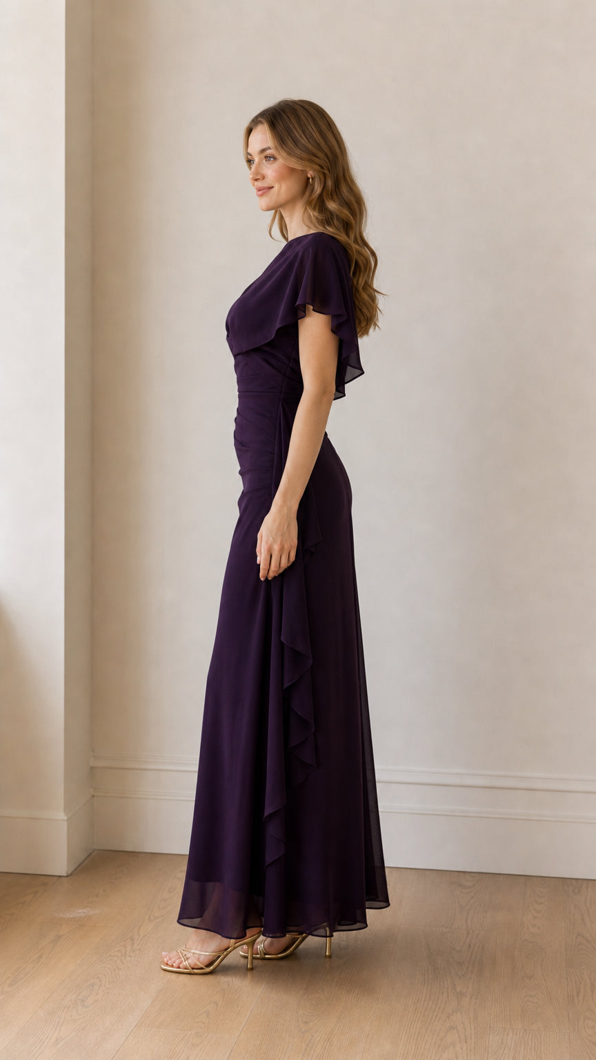 Side profile view of model in the purple chiffon maxi dress