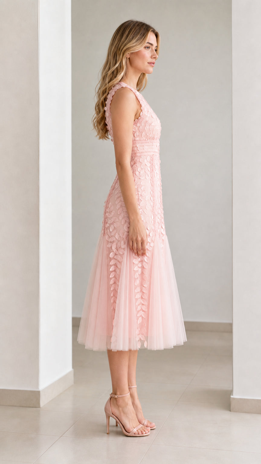 Side profile view of pink midi dress
