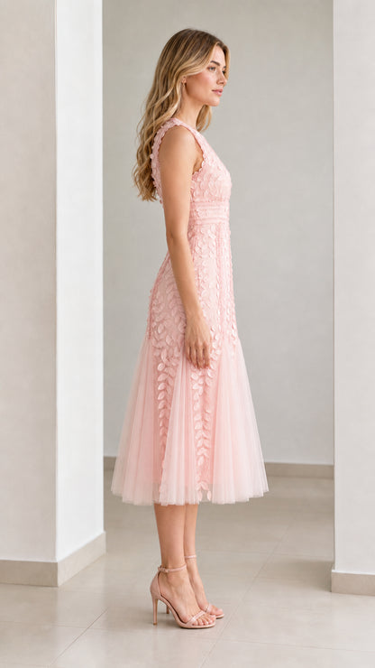 Side profile view of pink midi dress